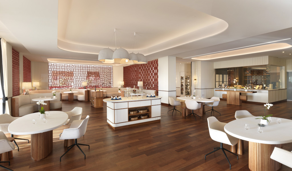Restaurante moderno con sillas blancas y mesas redondas en Tenerife.